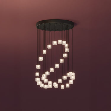Graypants Loci Mobius LED chandelier with black canopy, studio view