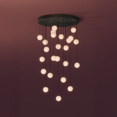 Graypants Loci Rain 24 LED chandelier with black canopy, studio view