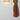 Skew 15 Blonde cardboard sconce lit on a wall, warm filtered glow
