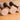 Horn Rattle by Eguchi Toys, end view of three horn rattles