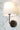 Emily Cordless Wall Sconce Black mounted on a modern wall