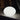 Smart & Green Flatball XXS white lamp glowing against a dark background