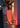 Smart & Green Tower cylinder lamp glowing red beside a wall
