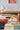 Artopia wool rug in Multi, styled in a room