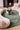 Collage wool rug in Sage, styled in a room