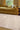 Délice viscose rug in Mastic, styled in a room