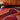 Muse wool rug in Red, styled in a room