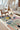Tête à Tête wool rug, styled in a room