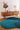Tumulus wool rug in Blue, styled in a room