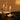 Graypants Wick Classic lifestyle, Mist Gray lamp at a restaurant table