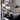 Astep VV Cinquanta Wall wall light, black reflector beside a bookcase