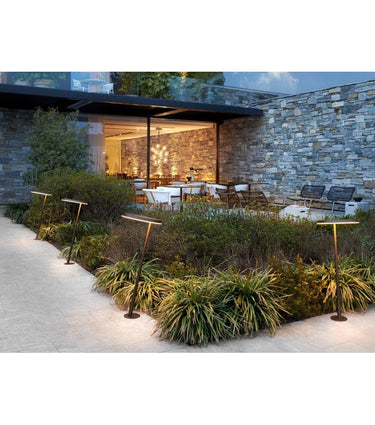 Amanita Outdoor Floor Lamp by Oluce in Indian brown finish for modern garden pathways