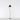 Modern LED floor lamp - Artemide La Petite - casting soft, ambient light in a bedroom, Black finish