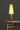 Basica M2 table lamp by Santa and Cole with birch wood column and beige parchment shade