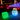 Green and light blue glowing Cube lamps beside a lit pool at night