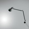 Artemide Tolomeo Classic wall light in brushed aluminum with adjustable arms for bedroom or office lighting