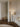 Adjustable Santa & Cole Pie de Salon G1 floor lamp beside a contemporary lounge chair