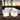 Two white Big Cube lamps (17 in) glowing at sunset on a pool terrace with palm trees