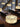 Large Sexta 12 pendant light suspended above modern dining table