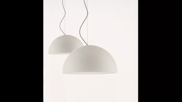 Oluce Sonora 411 opaline glass dome pendant light in a dining room