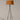 Designer tripod floor lamp with warm red amber shade