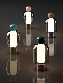Lodes Easy Peasy portable LED lamp in Flamingo with brushed bronze base, glowing on a modern side table.