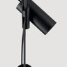 Styled shot of Lodes Cima providing task lighting over a desk, with a vibrant yellow rope cord.