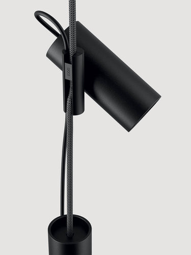 Styled shot of Lodes Cima providing task lighting over a desk, with a vibrant yellow rope cord.