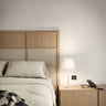 Modern white LED table lamp with floating paper shade for minimalist interiors