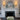 Emily rechargeable wall sconces in antique brass on each side of a fireplace mirror