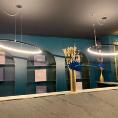 Egoluce lighting at LoftModern: Lancia Tonda rings over a dining room