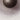 Close-up of the fritted glass around the bronze center boss of the Cielo light