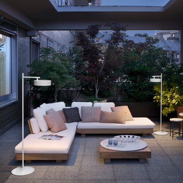 Oluce Berlin-Out floor lamp on a roof terrace lounge