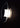 Oluce Yolk wall lamp lit, side view of the opal glass diffuser inside the curved clear glass shell