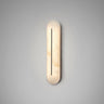 Hepworth wall light in bronze with a rounded honed alabaster panel and a fine dark central line, lit on a grey wall