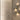 Penta Enoki gold wall sconces with half-dome shades lighting an interior wall