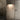 Dark Penta Enoki wall sconce beside a door