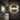 Penta Hang Out wall lamp with a round panel on a dark wall