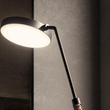 Penta Spoon floor lamp beside an armchair