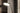 Penta Spoon floor lamp beside an armchair