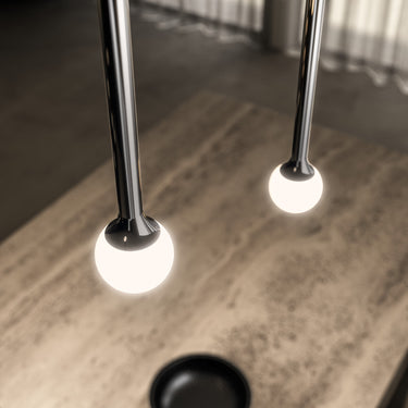 Penta Storm pendants in three stem lengths and several finishes hung together