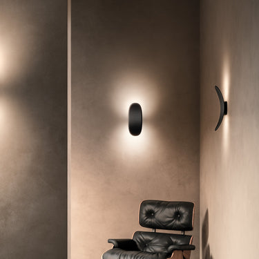 Penta Vela sail-shaped wall sconces lighting an interior wall