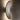 Penta Vela wall sconce in a second finish, lit on a wall