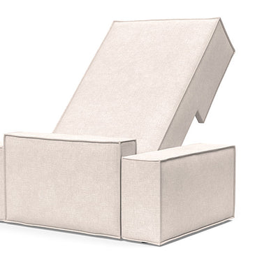 Newilla lounger chair in Adario Basmati with deep seating, wide arms, and built-in storage for small spaces