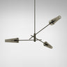 Axis pendant in bronze with 3 conical smoked glass shades, studio view