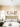 isual Comfort Photon 48 chandelier demonstrating its large 48-inch scale in a room