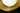 Close-up of the brass inner shade with perforations around the opal glass globe