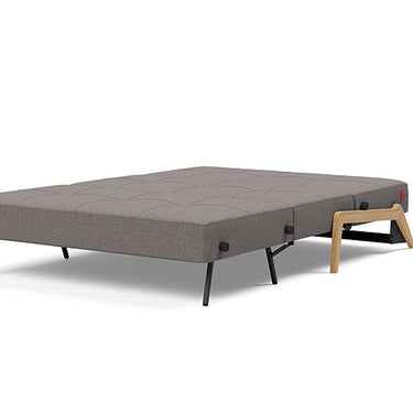 Modern compact sofa bed by Innovation Living in 521 Mixed Dance Grey upholstery with oak legs for small rooms and studios