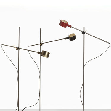 Modern adjustable G.O. floor lamp with black nickel arm and satin gold details