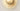 Close-up of the fritted glass around the satin brass center boss of the Cielo light